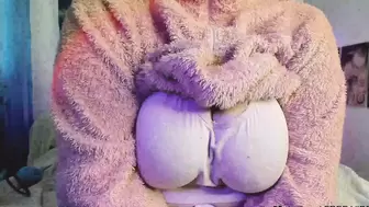 a meaty woman in a fluffy suit shows her body