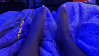 African teenie shows size 10 feet under blue light