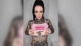 Alluring tattooed chick trying on sweet outfits