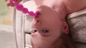 She felt bad blowing a dildo in such a difficult pose