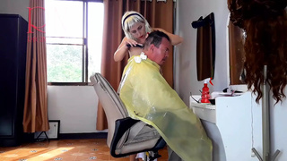 Nudist barbershop. Nude bitch hairdresser in an apron. The client is surprised. web-cam two two