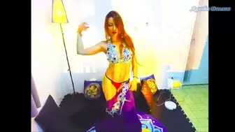 Sexy red-head makes sensual strip tease during belly dance